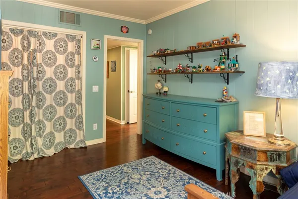 a room with furniture and wooden floor