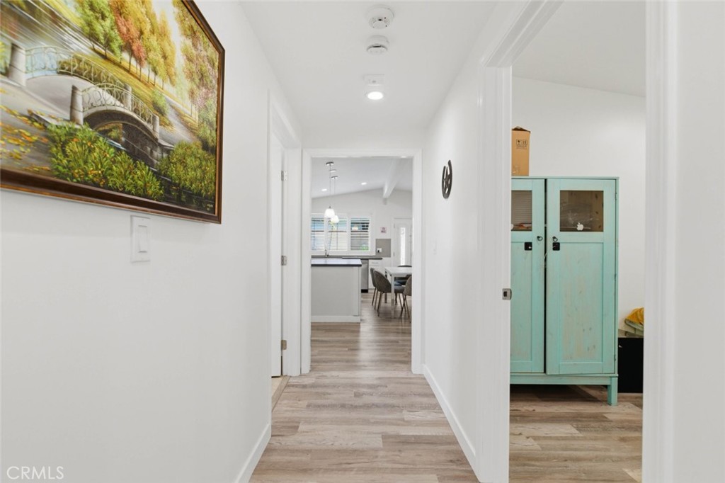 301 West Ashby Street Azusa, CA 91702 - Photo 29 of 75 a view of a hallway with wooden floor and a bathroom
