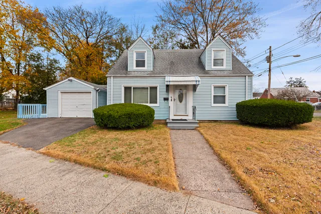 a house with a large tree in front of it
