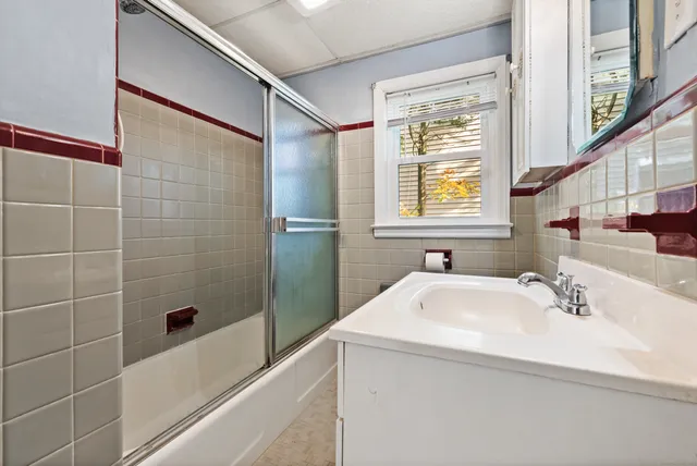 a bathroom with a sink a shower and a bathtub