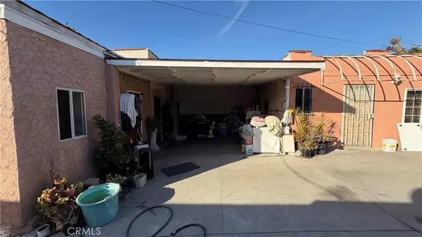 a view of a chairs and table in backyard
