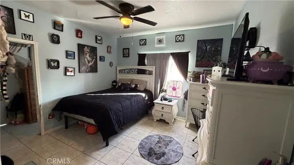 a bedroom with bed and a window