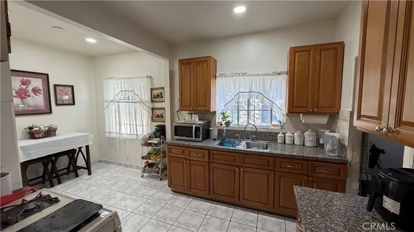 a kitchen with sink cabinets and window
