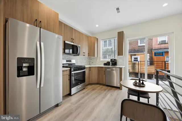 a bedroom with a large bed and a large window