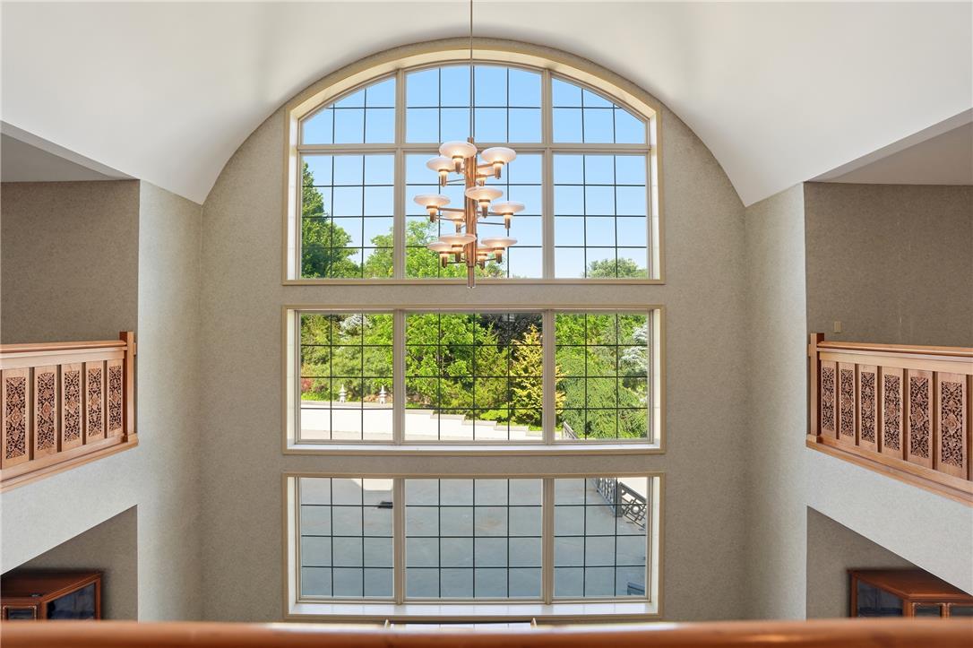 6271 Batman Road Zionsville, PA 18092 - Photo 75 of 100 A grand entry showcases soaring arched windows, filling the space with natural illumination and verdant views.