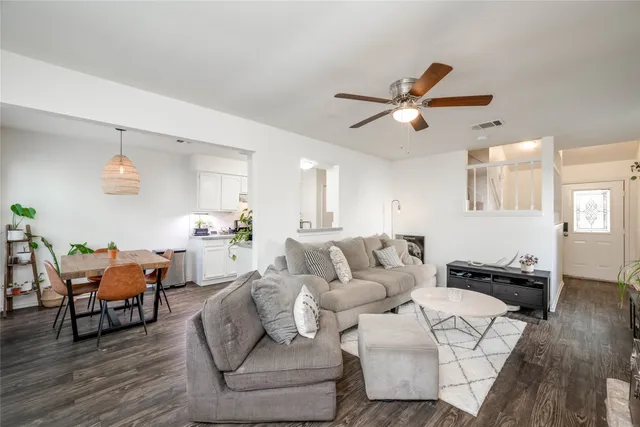 a living room with furniture or kitchen and a wooden floor