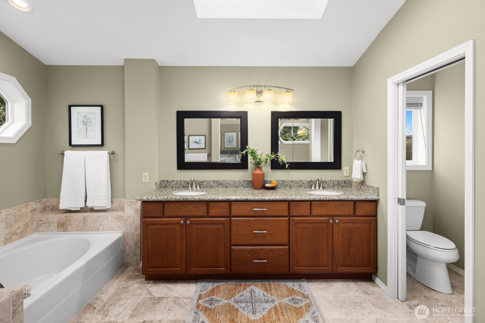 16708 5th Avenue Northeast Shoreline, WA 98155 - Photo 18 of 38 a spacious bathroom with a granite countertop tub sink and mirror