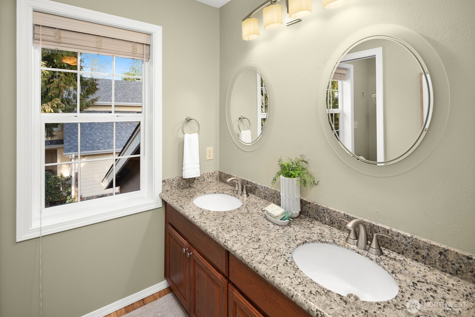 16708 5th Avenue Northeast Shoreline, WA 98155 - Photo 21 of 38 a bathroom with a granite countertop double vanity sink and a mirror