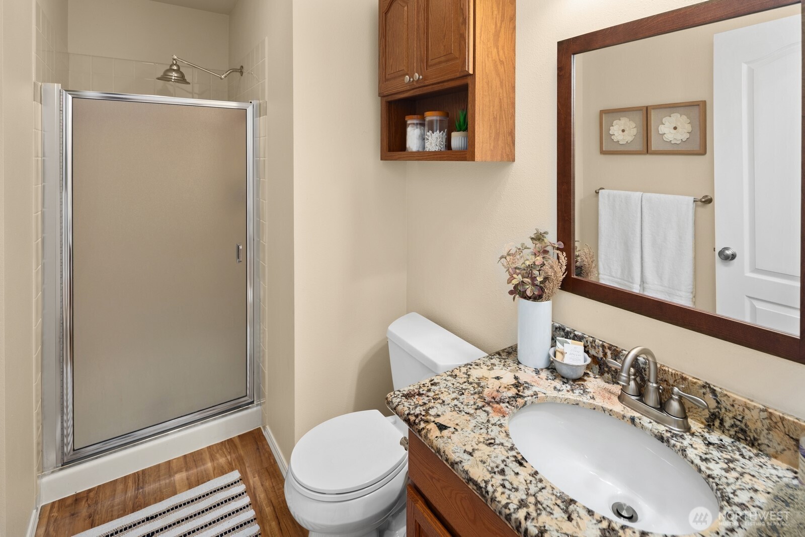 16708 5th Avenue Northeast Shoreline, WA 98155 - Photo 27 of 38 a bathroom with a granite countertop sink mirror vanity and toilet