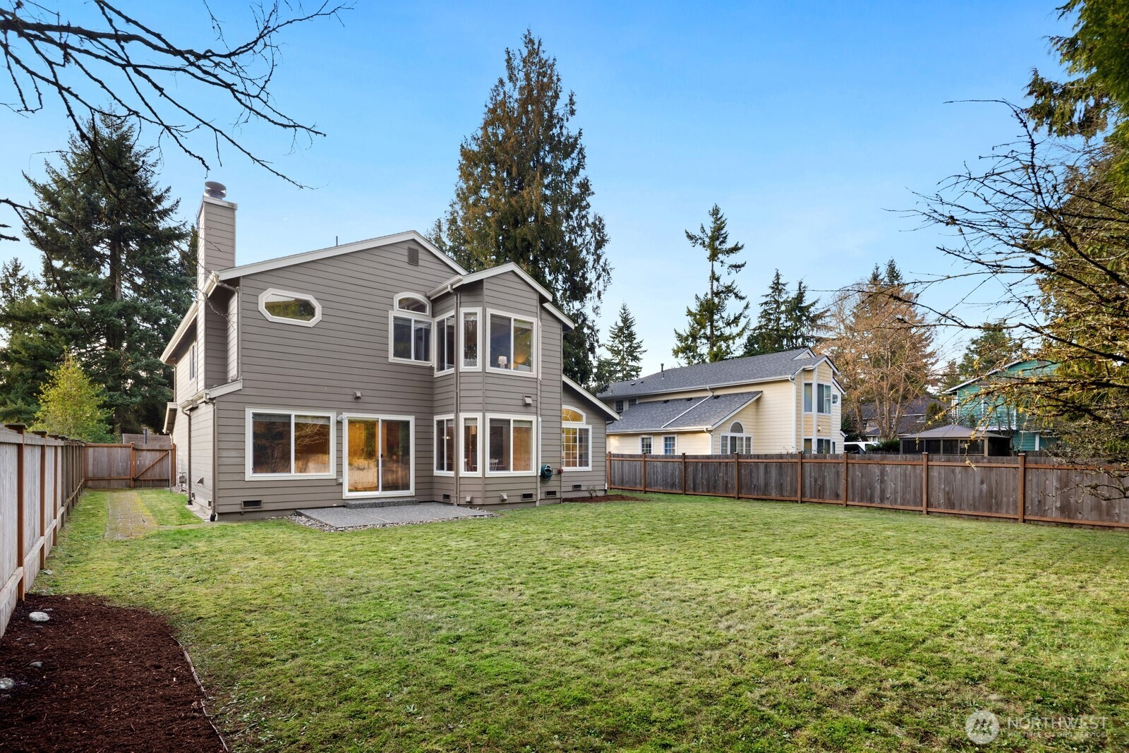 16708 5th Avenue Northeast Shoreline, WA 98155 - Photo 31 of 38 a front view of a house with a garden and trees