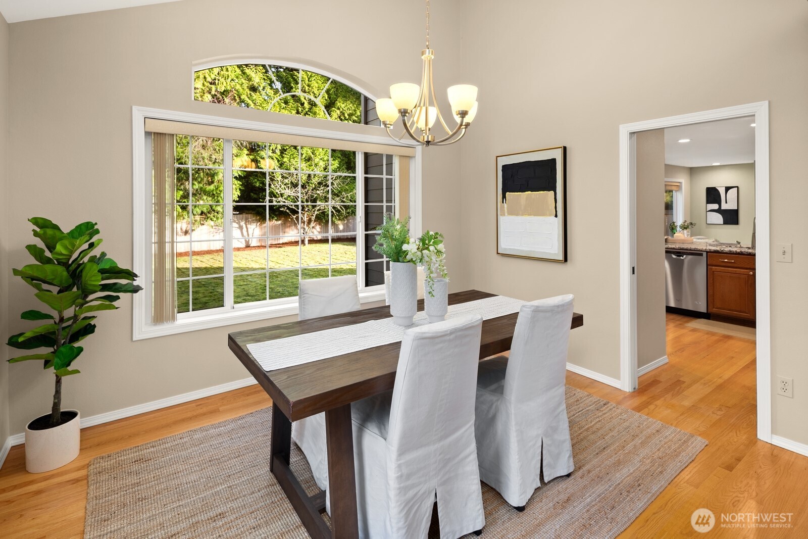 16708 5th Avenue Northeast Shoreline, WA 98155 - Photo 9 of 38 a view of a dining room with furniture window and wooden floor