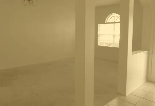 a view of a bathroom with wooden floor and window