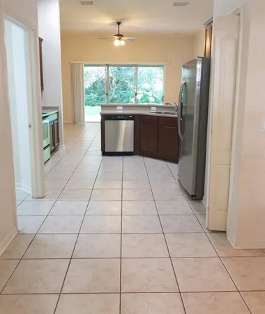 a view of kitchen with furniture and large window