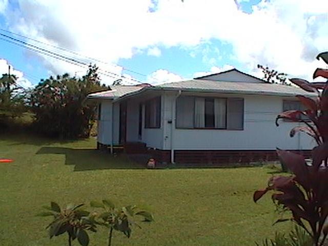 17-222 Volcano Road Keaau, HI 96749 - Photo 1 of 6 a front view of a house with a yard