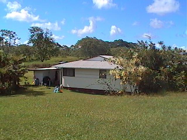 17-222 Volcano Road Keaau, HI 96749 - Photo 3 of 6 a view of a house with a yard