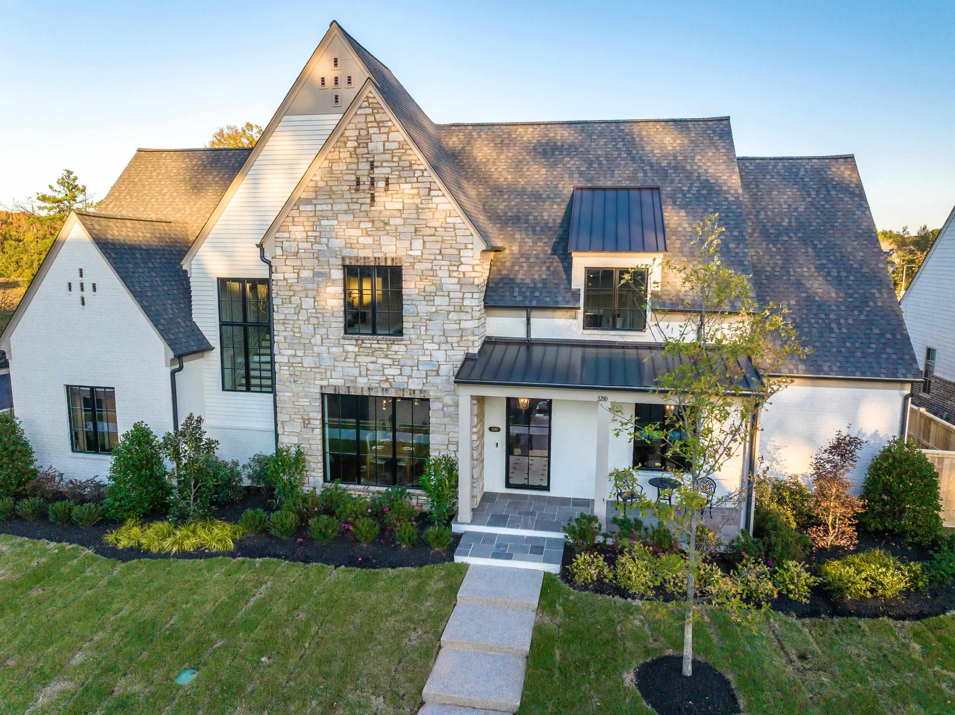 a front view of a house with a yard