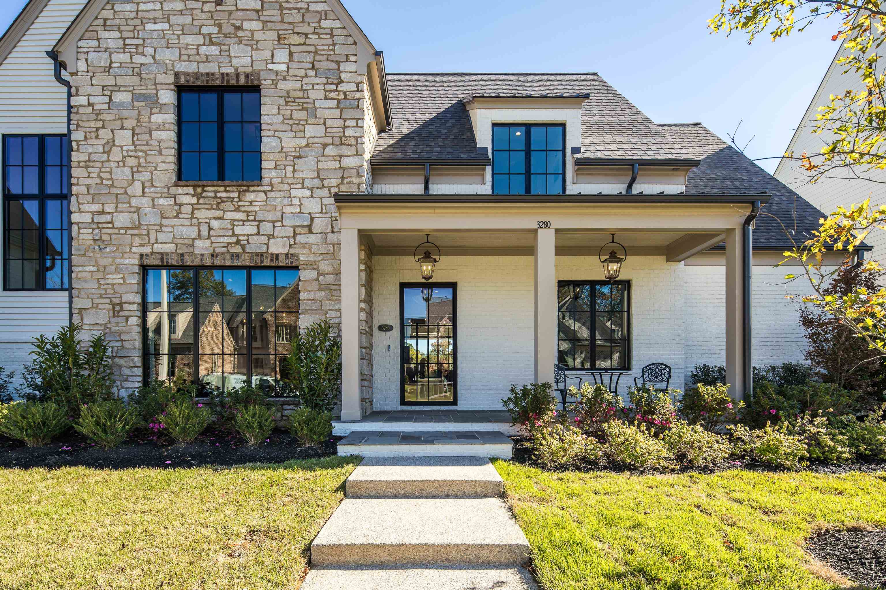 3280 Hidden Creek Loop West Collierville, TN 38017 - Photo 2 of 40 a front view of a house with garden