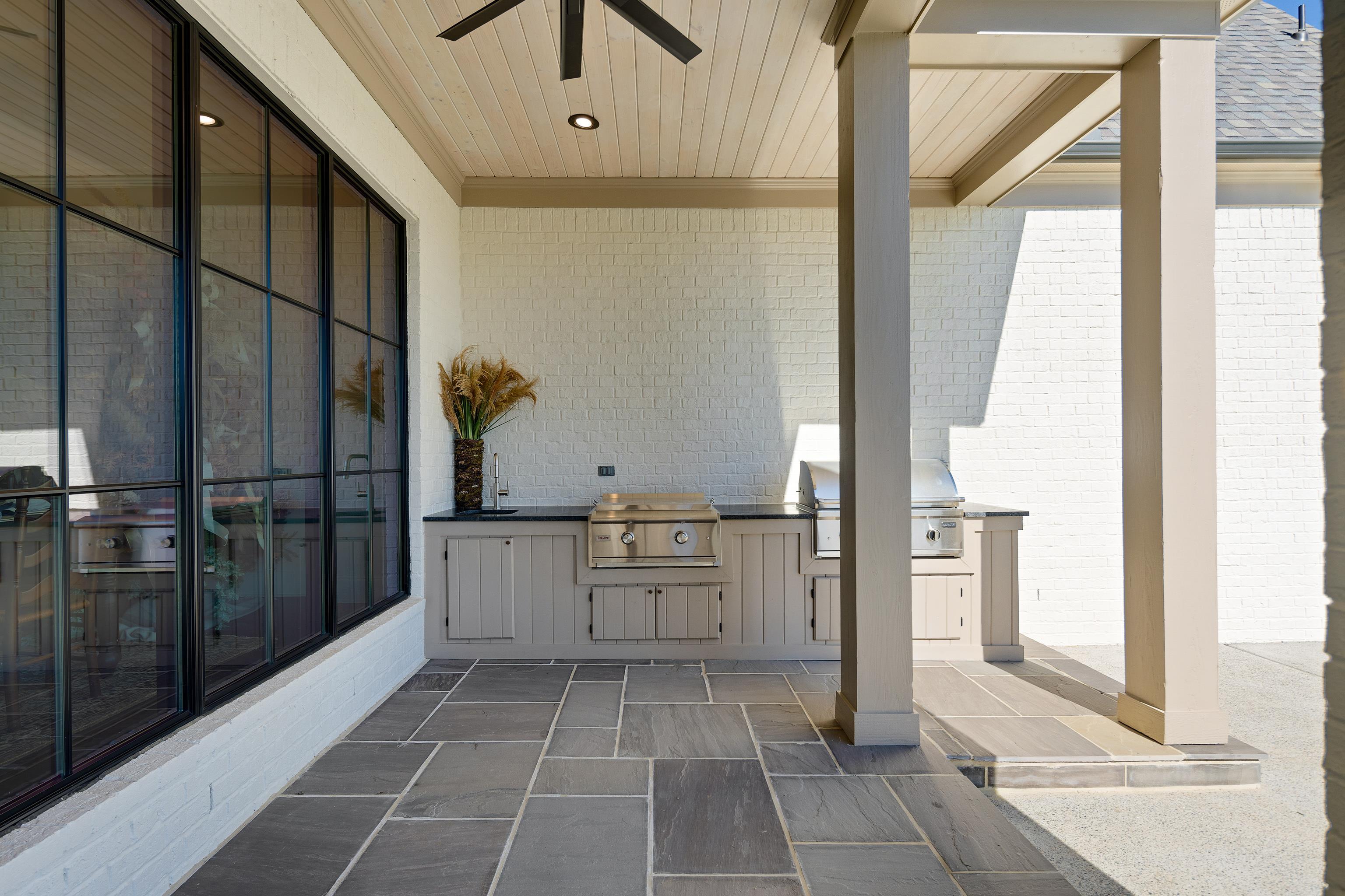 3280 Hidden Creek Loop West Collierville, TN 38017 - Photo 34 of 40 a kitchen with a refrigerator and white cabinets