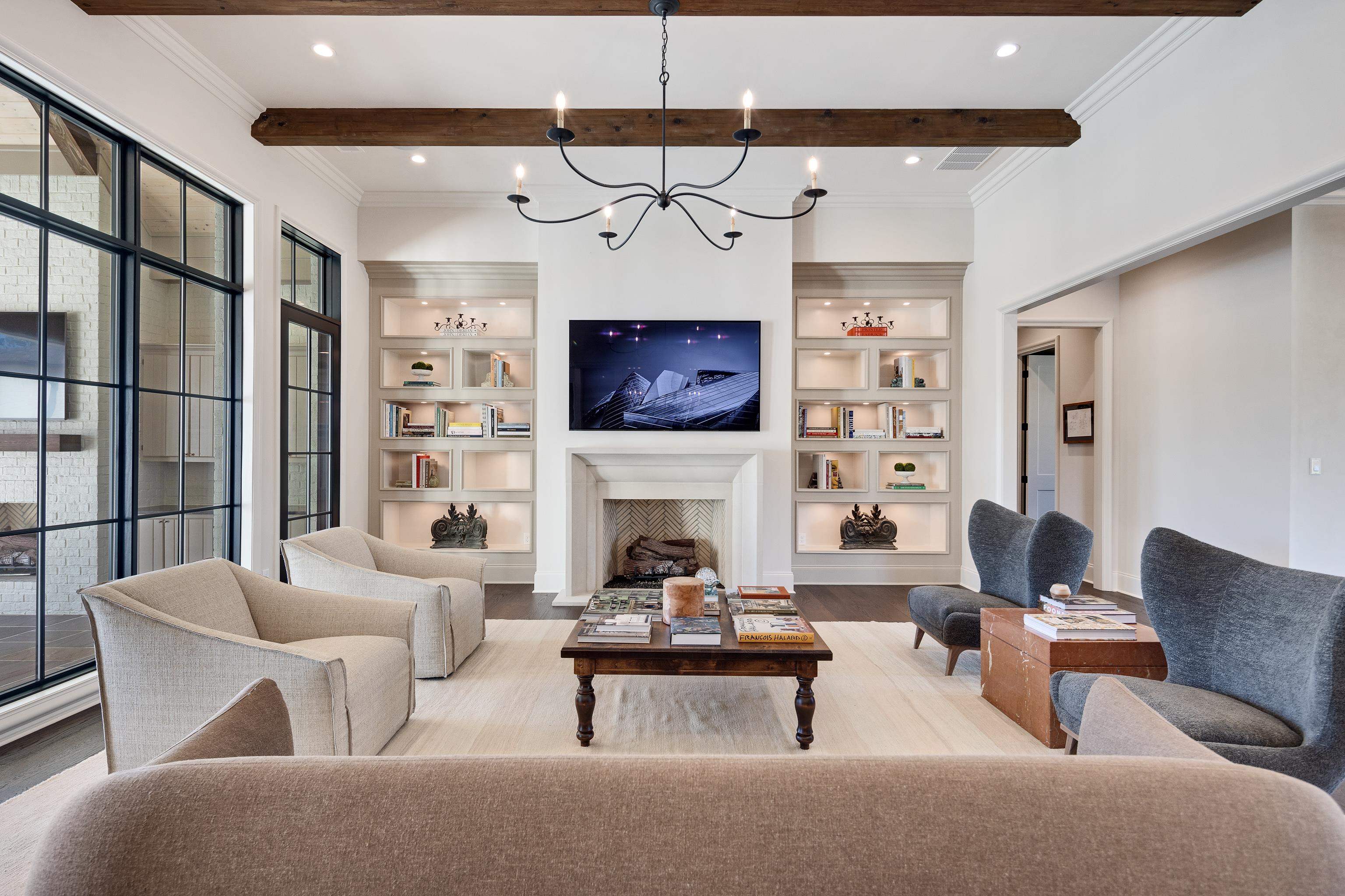 3280 Hidden Creek Loop West Collierville, TN 38017 - Photo 9 of 40 a living room with furniture a fireplace and a chandelier