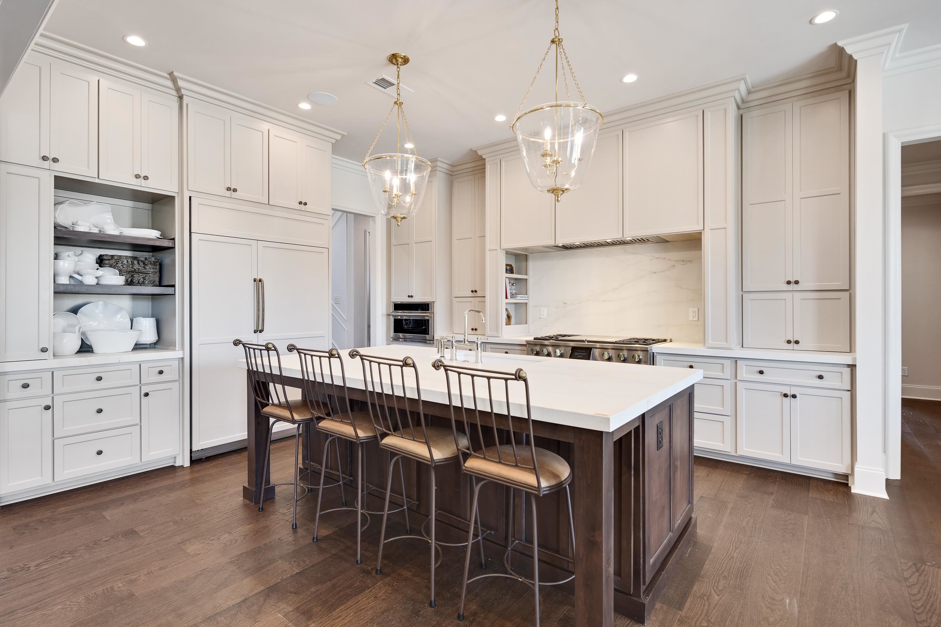 3280 Hidden Creek Loop West Collierville, TN 38017 - Photo 10 of 40 a kitchen with white cabinets and stainless steel appliances
