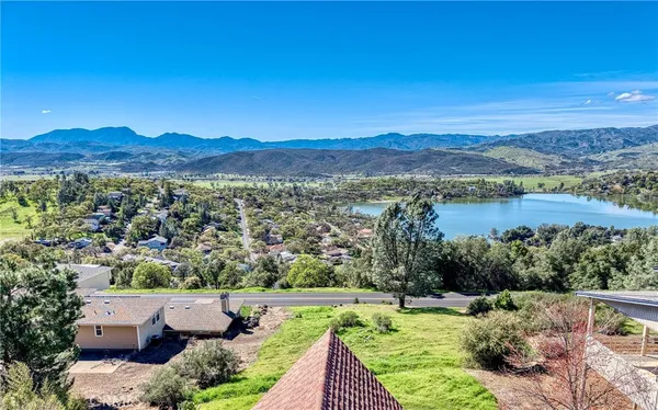 a view of a balcony with floor to ceiling windows with wooden floor