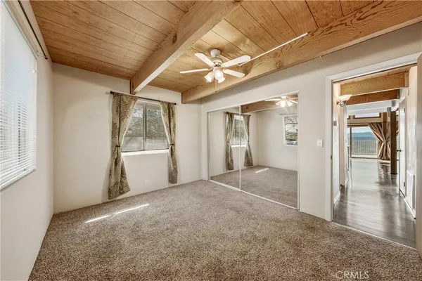 a bedroom with a large bed and furniture