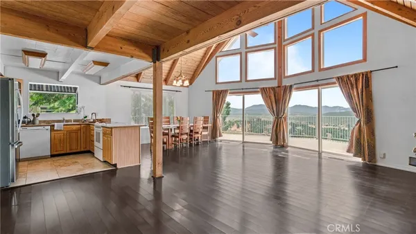 a view of a house with a yard and furniture