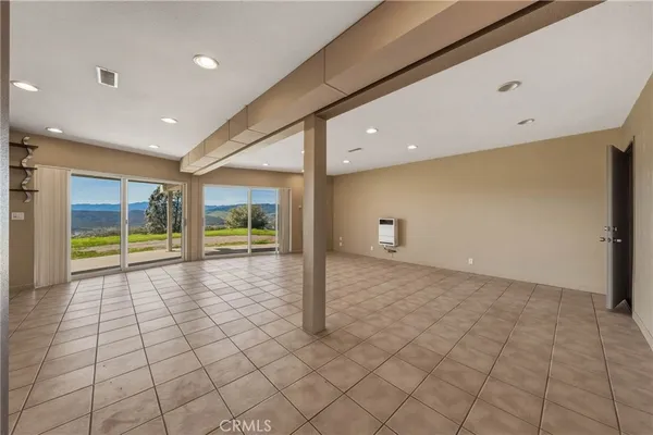 a view of walk in closet with wooden floor