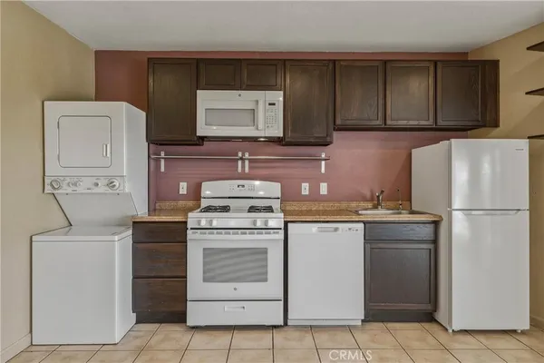 a view of staircase with white walls and a window