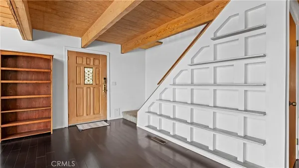 a view of mountain with sunset in background