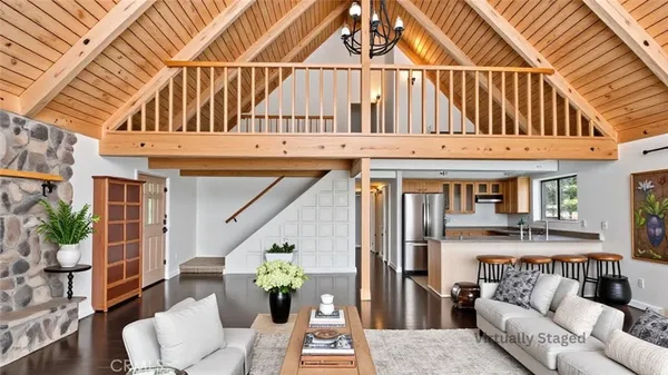 a kitchen with a stove and wooden floor