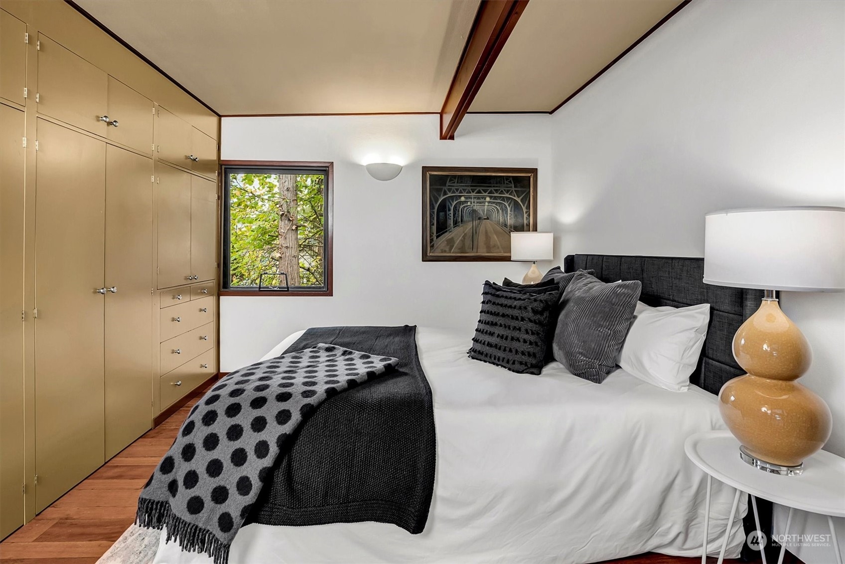1360 Southwest 175th Street Normandy Park, WA 98166 - Photo 11 of 29 a bedroom with a bed and wooden floor
