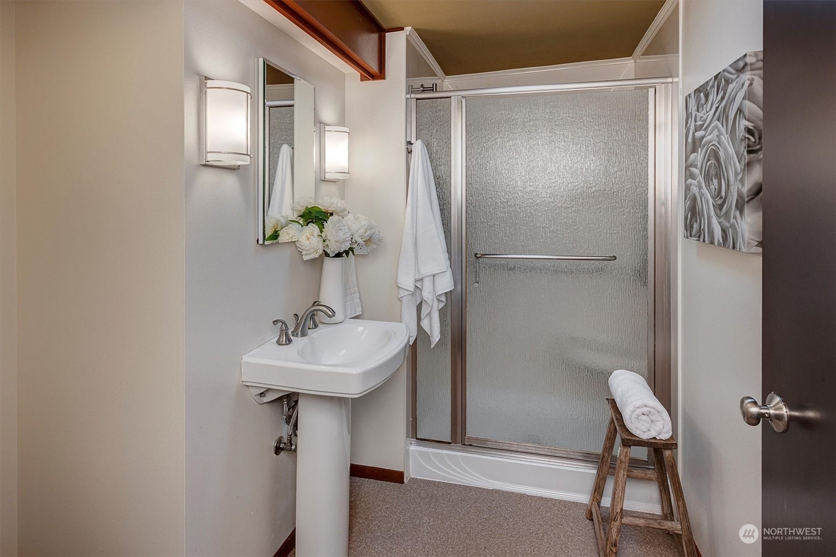 1360 Southwest 175th Street Normandy Park, WA 98166 - Photo 13 of 29 a bathroom with a sink a mirror and a shower