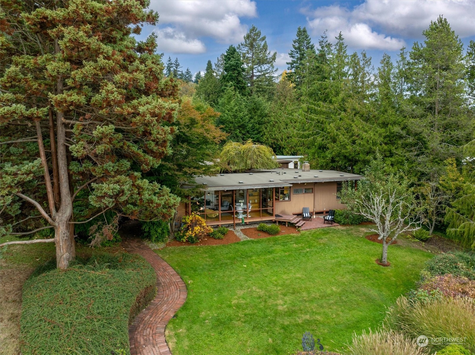 1360 Southwest 175th Street Normandy Park, WA 98166 - Photo 22 of 29 a view of a house with a big yard and potted plants and large trees