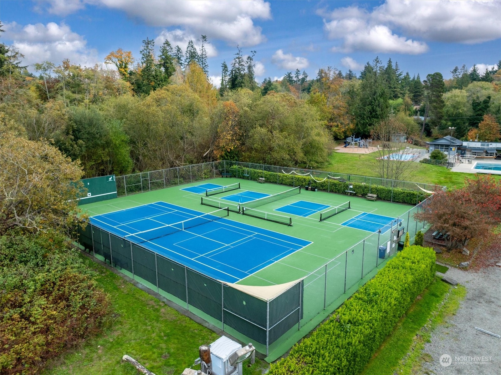 1360 Southwest 175th Street Normandy Park, WA 98166 - Photo 29 of 29 a view of a tennis ground with large trees