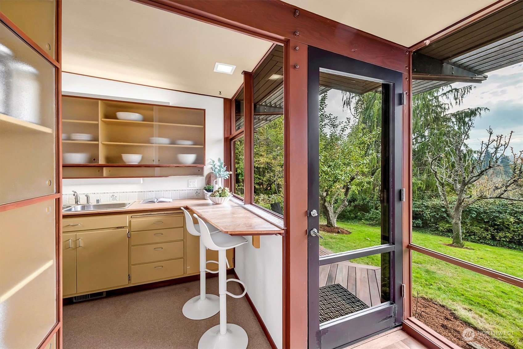 1360 Southwest 175th Street Normandy Park, WA 98166 - Photo 6 of 29 a kitchen that has a sink and a large window