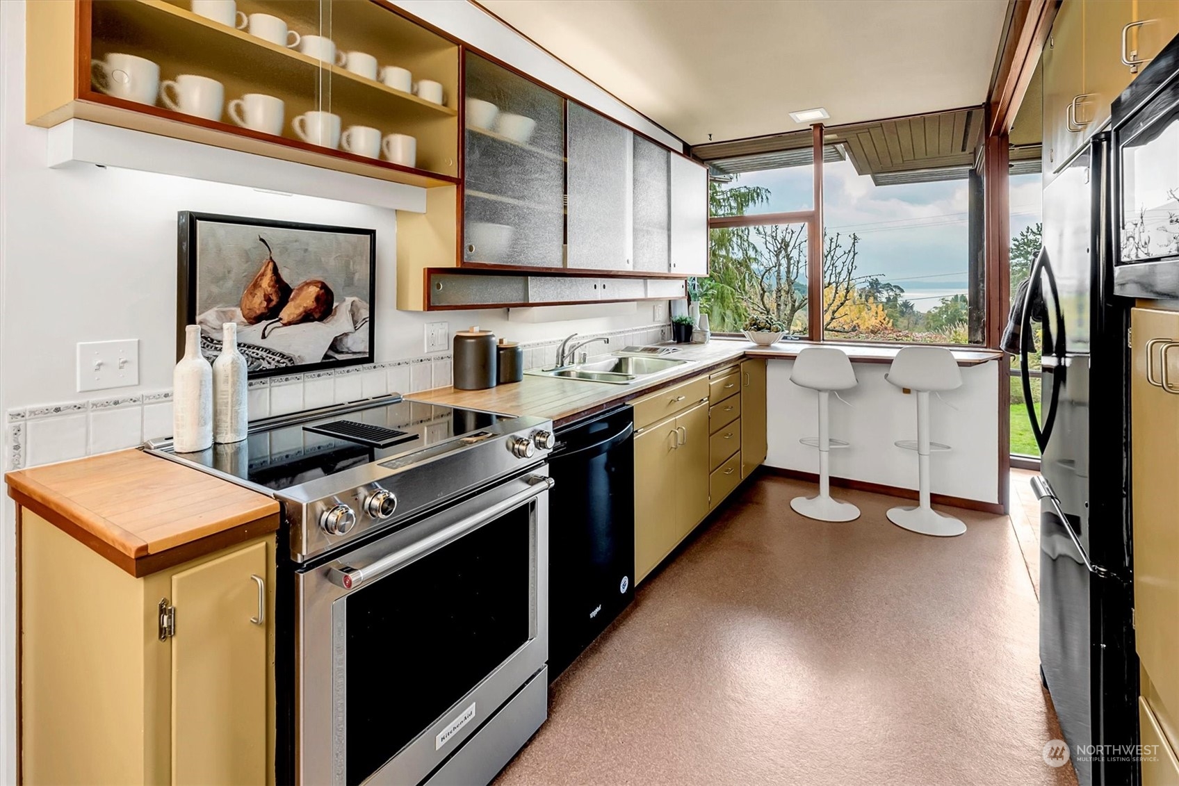 1360 Southwest 175th Street Normandy Park, WA 98166 - Photo 7 of 29 a kitchen with a stove and a sink