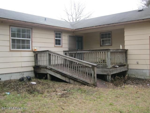 1375 Lee Road St. Johns, FL 32259 - Photo 1 of 15 a view of a wooden deck with a bench and wooden fence