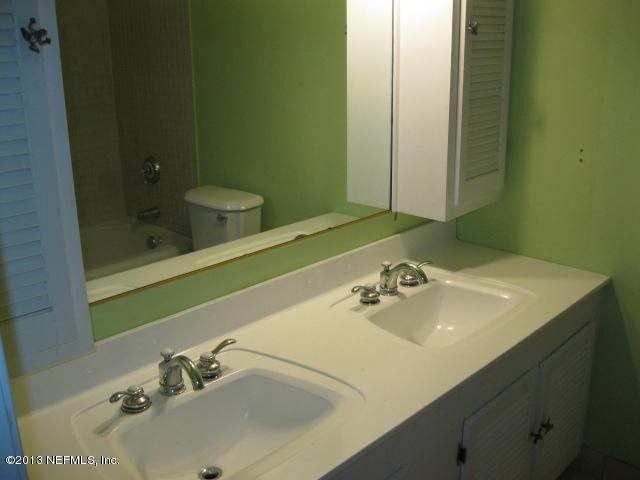 1375 Lee Road St. Johns, FL 32259 - Photo 8 of 15 a bathroom with a sink and a mirror
