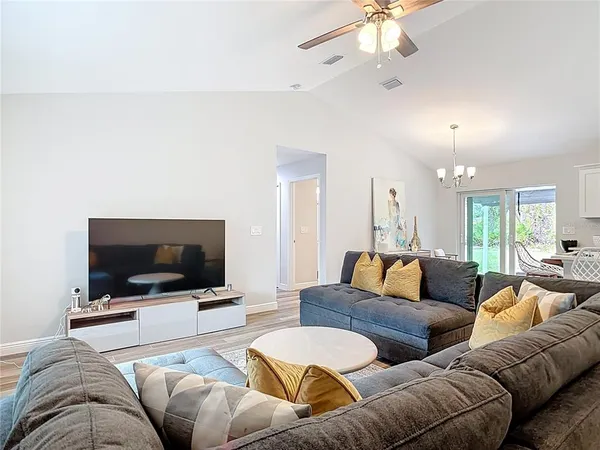 a living room with furniture and a large window