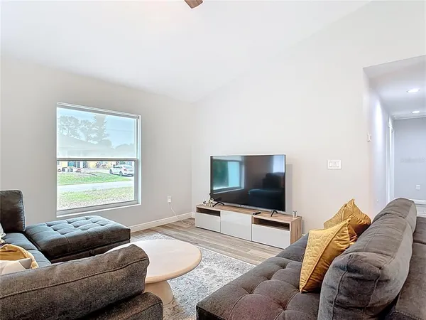 a view of a hallway with a wooden floor