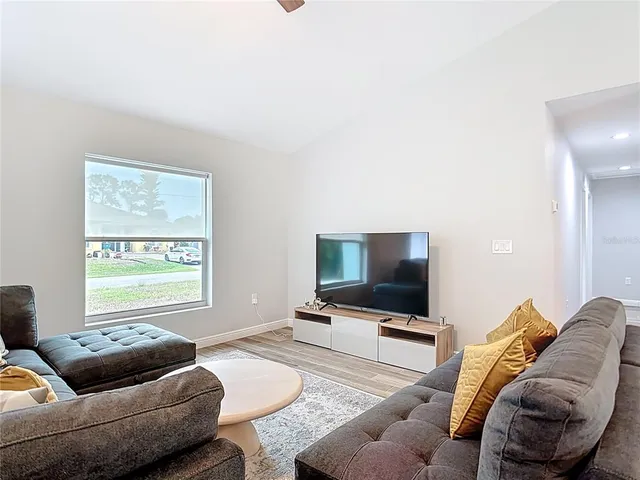 a view of a hallway with a wooden floor