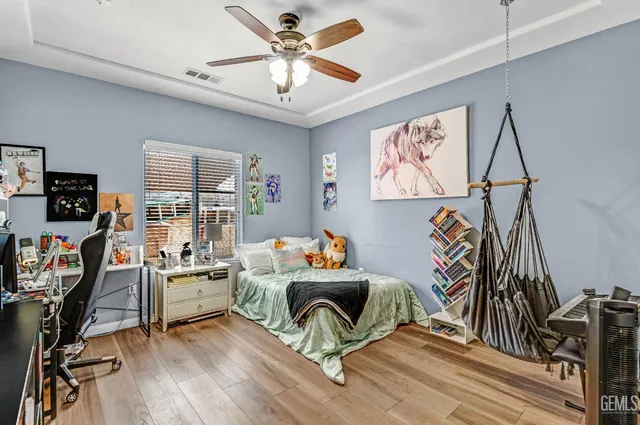 a bathroom with a granite countertop tub sink and mirror