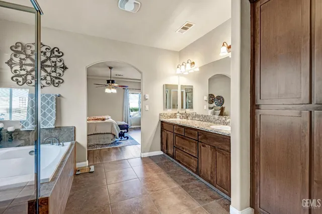 a view of a livingroom with furniture and floor to ceiling window