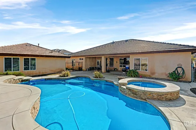 a kitchen with a stove a refrigerator and a stove top oven