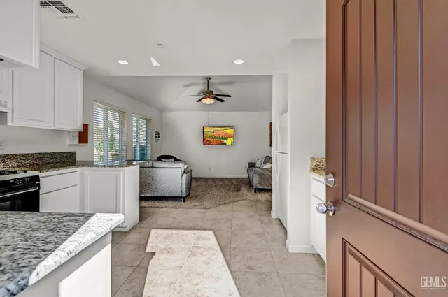 an aerial view of a house with a yard and potted plants