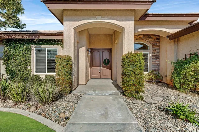 a view of a hallway and a livingroom with furniture