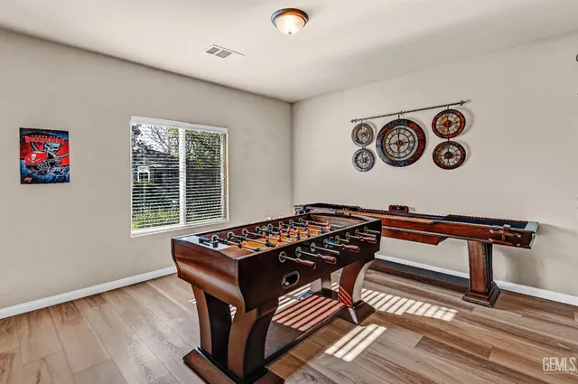 a living room with furniture and painting on the wall