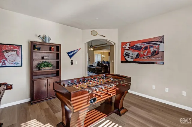 a dining room with furniture a chandelier and window