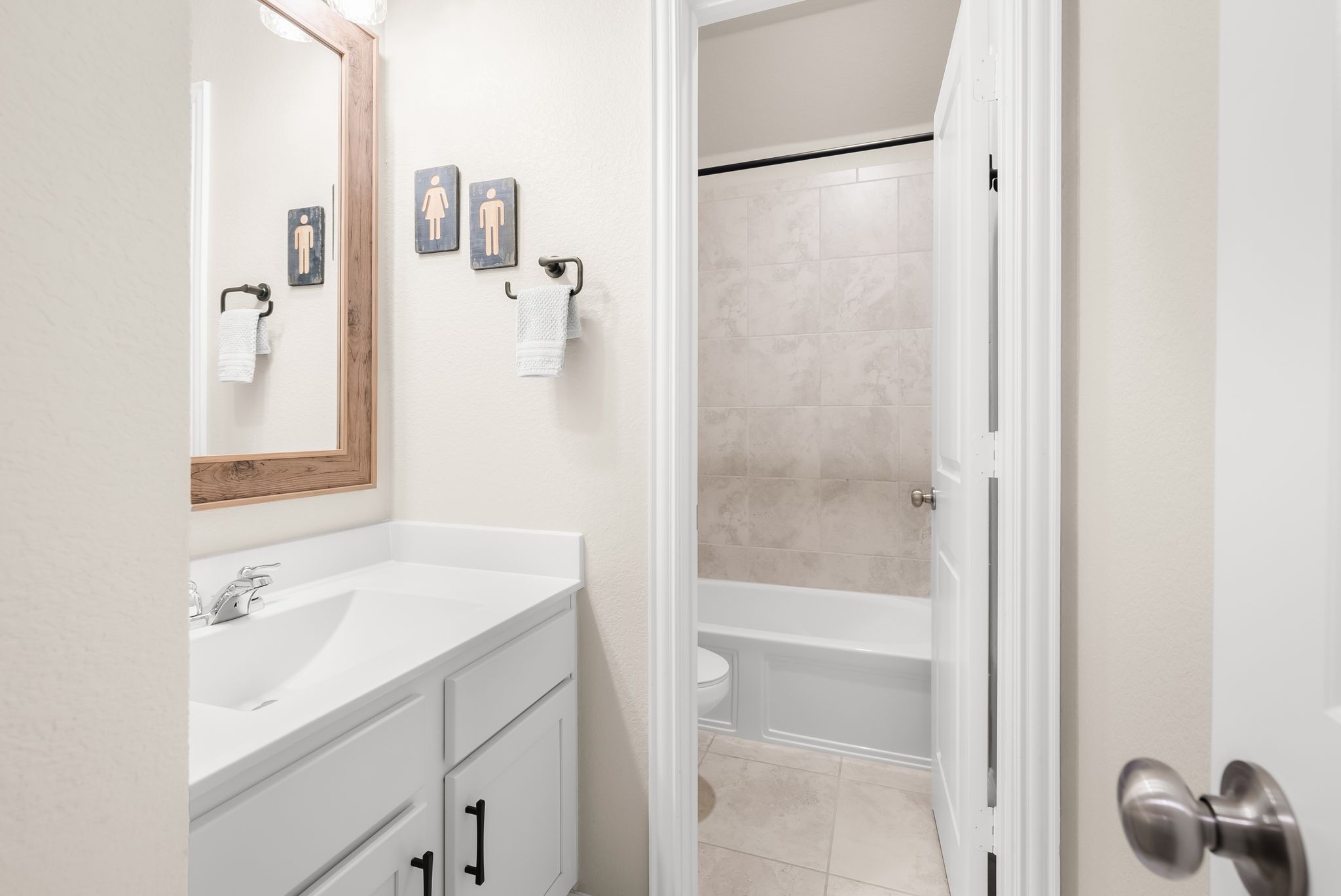 300 Prato Place Georgetown, TX 78628 - Photo 24 of 40 Modern bathroom featuring a single vanity and a tiled tub and shower combination.
